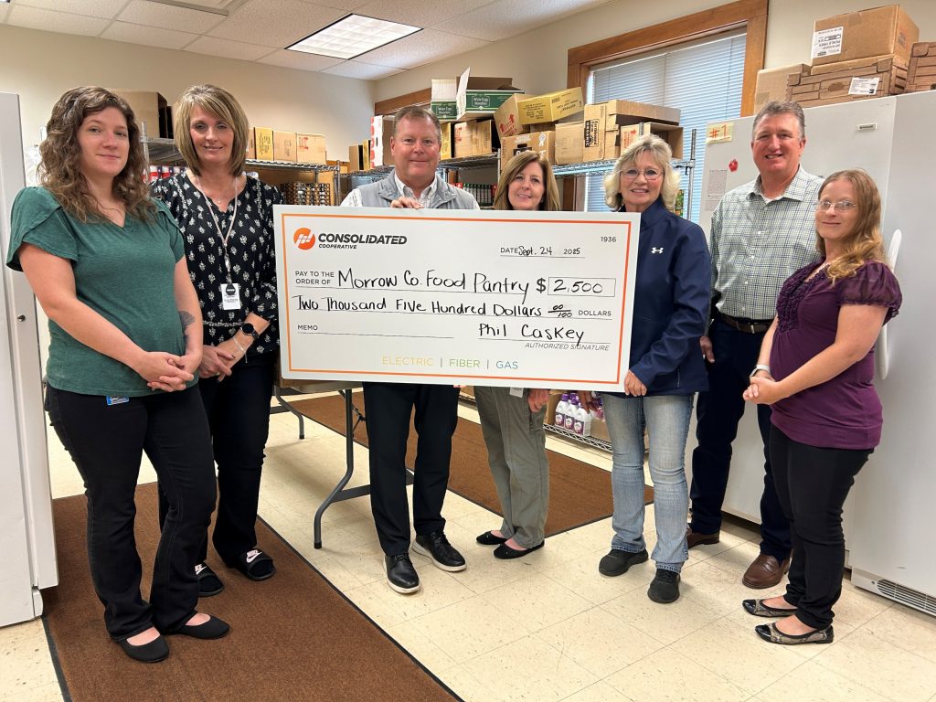 Consolidated Employees with the Morrow County Food Pantry team, holding a donation check for $2,500