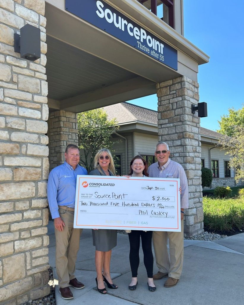 Consolidated employees with the SourcePoint team holding a check for $2,500